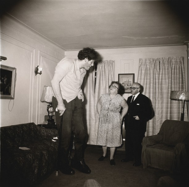 A Jewish giant at home with his parents in the Bronx, N.Y.