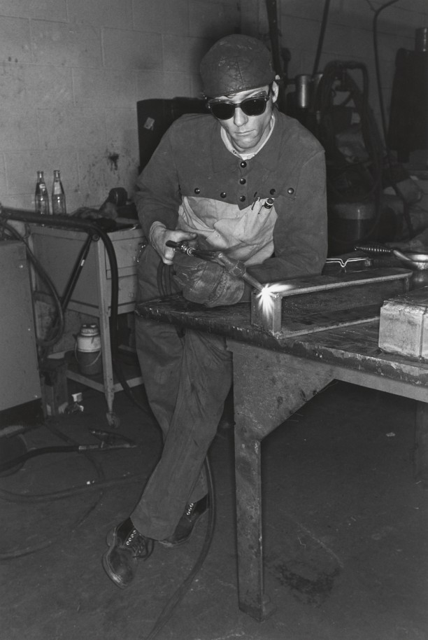 AKRON, OHIO (man leaning and welding)