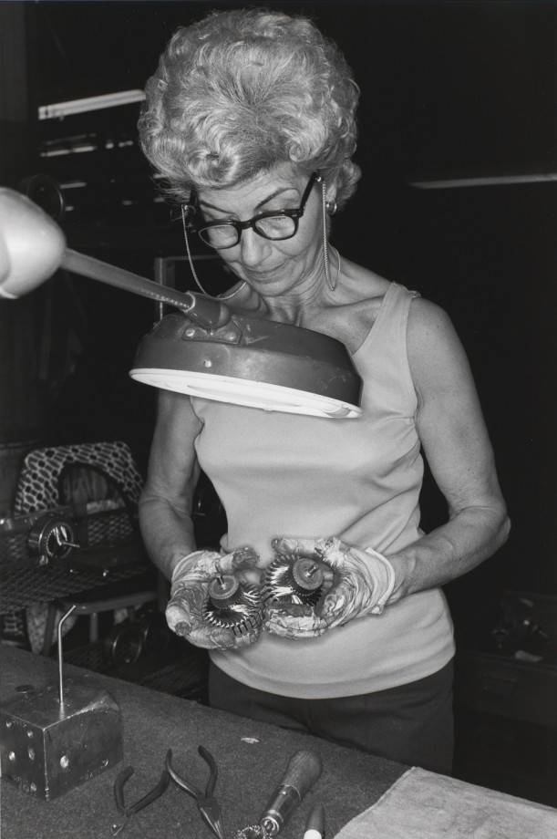 CANTON, OHIO (woman looking at objects under light)