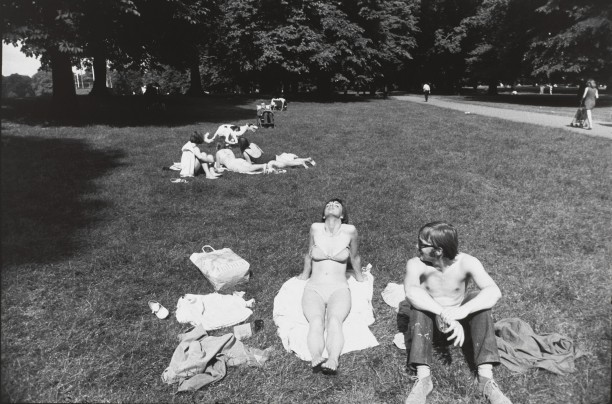 Untitled (Woman and man sunbathing in a park)