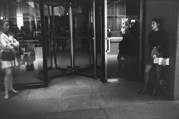 Untitled (Two women on either side of a revolving door)