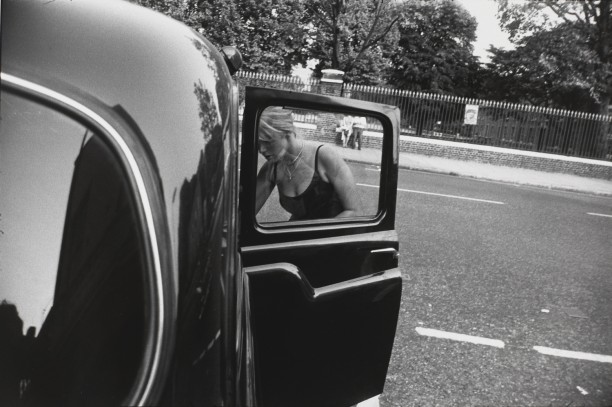 Untitled (Woman leaning into a black car)