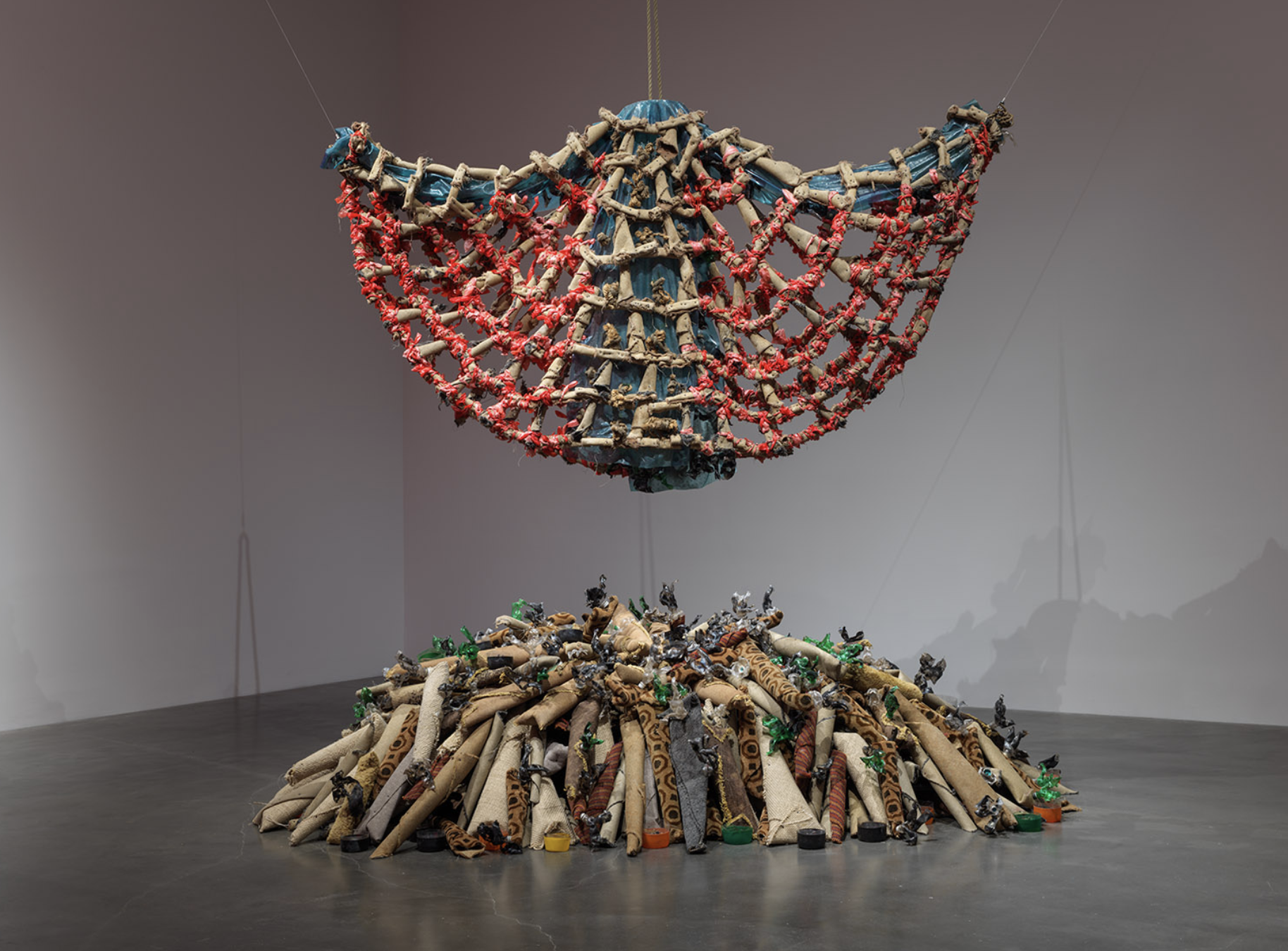 Nari Ward, Carpet Angel, 1992, Carpet, plastic bags, plastic bottles, vinyl carpet runner, springs, wood screws, and rope. Gift of Jennifer McSweeney, in memory of Joan “Penny” McCall.